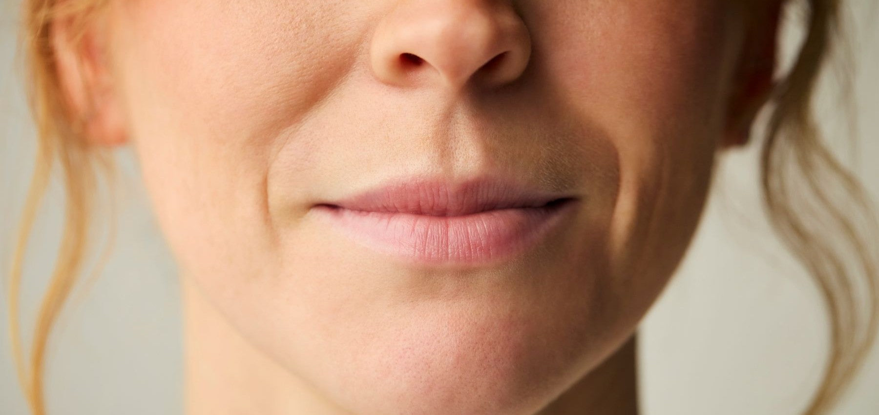 Close-up of a woman's upper lip showing fine lines