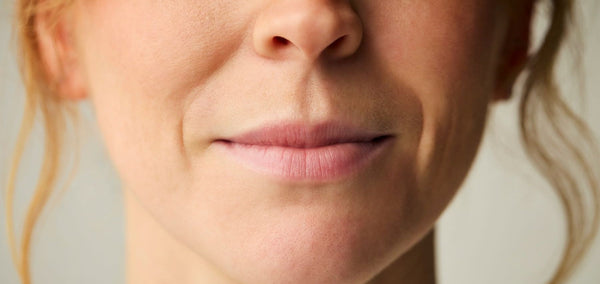 Close-up of a woman's upper lip showing fine lines